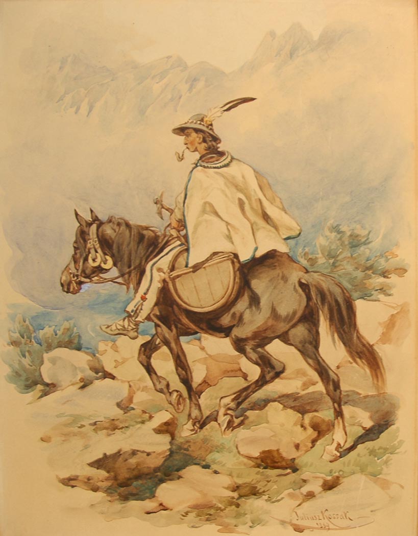 Man Riding on Horseback through the Mountains